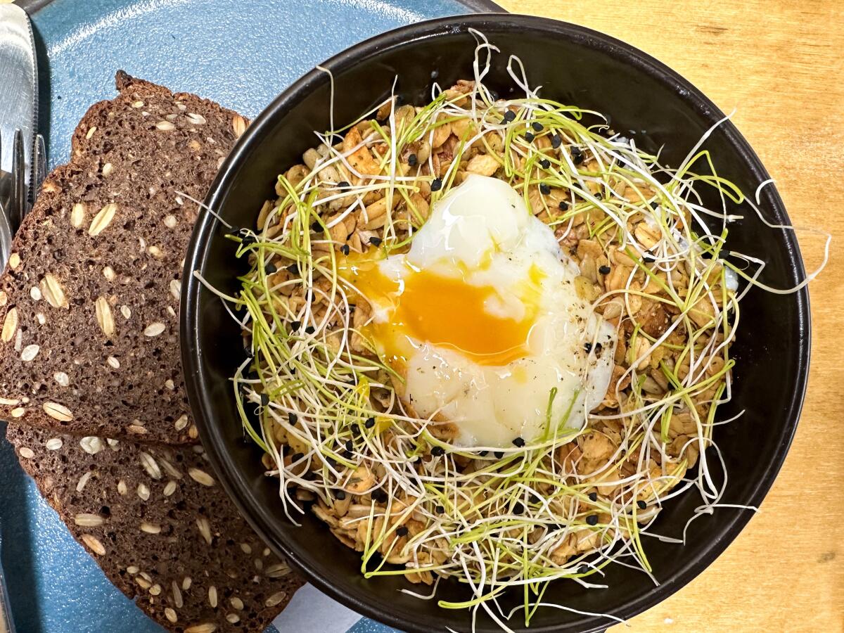 Smoked fish, under a layer of savory granola and a poached egg, at Destroyer in Culver City.