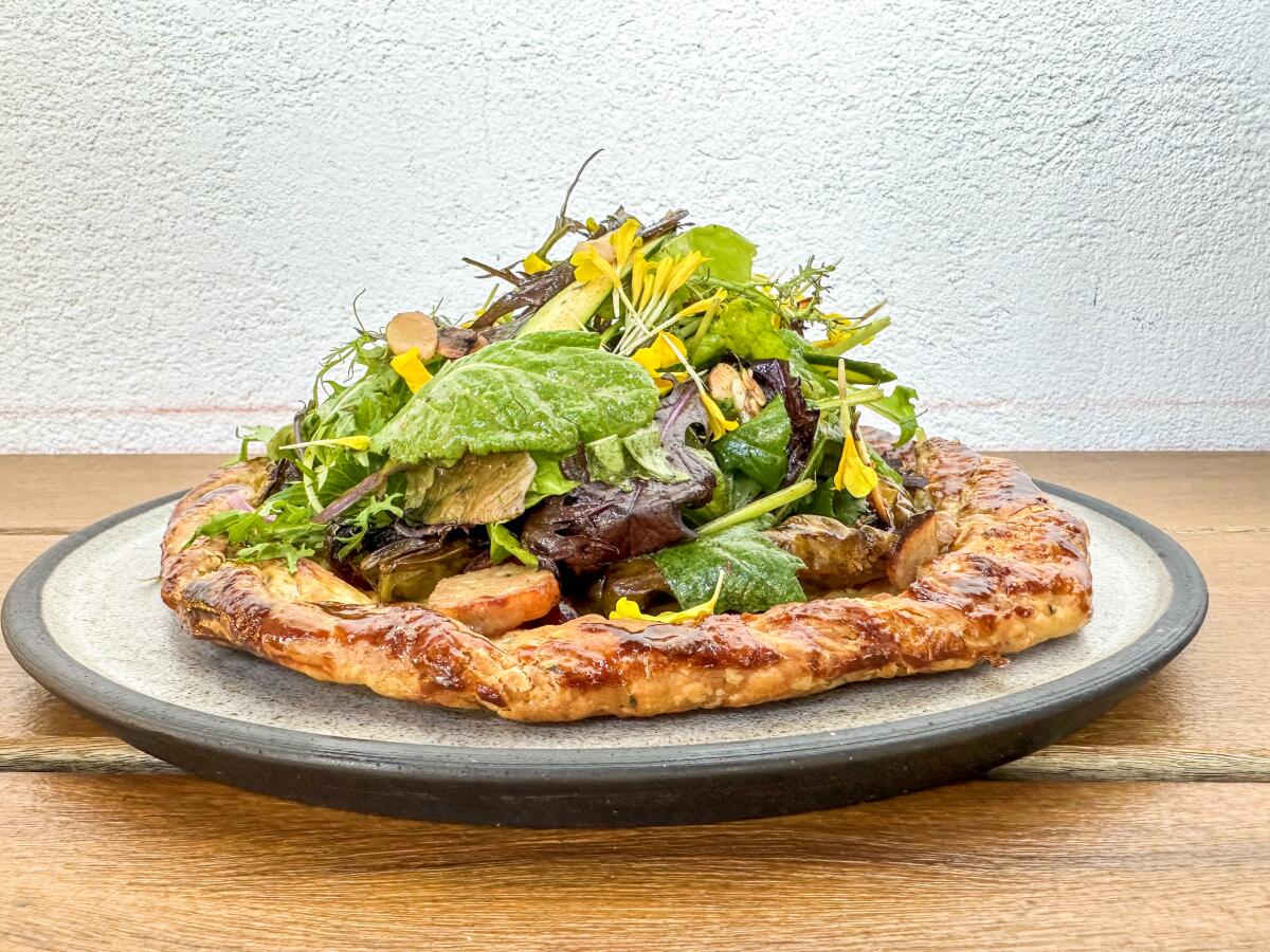 Courgette and goat cheese tart, piled with greens, at Destroyer in Culver City.