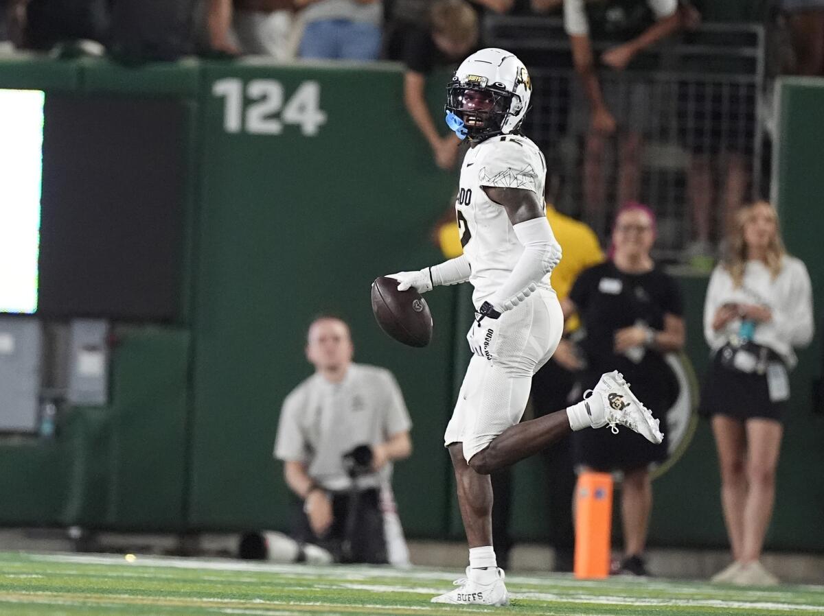 Colorado cornerback Travis Hunter celebrates after intercepting against Colorado State in September.