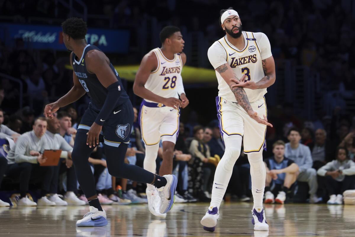 Lakers star Anthony Davis gestures after making a three-pointer against the Grizzlies.