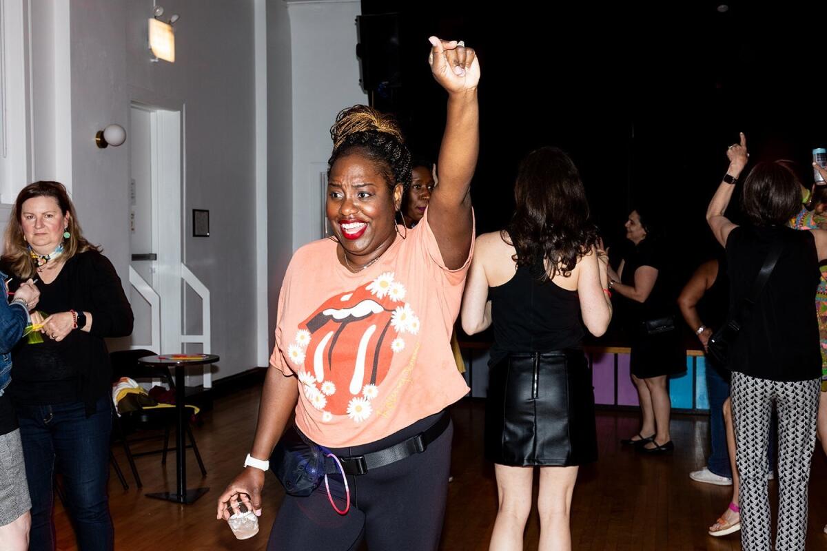 An attendee turns up and dances to the music at an Earlybirds Club party in May.