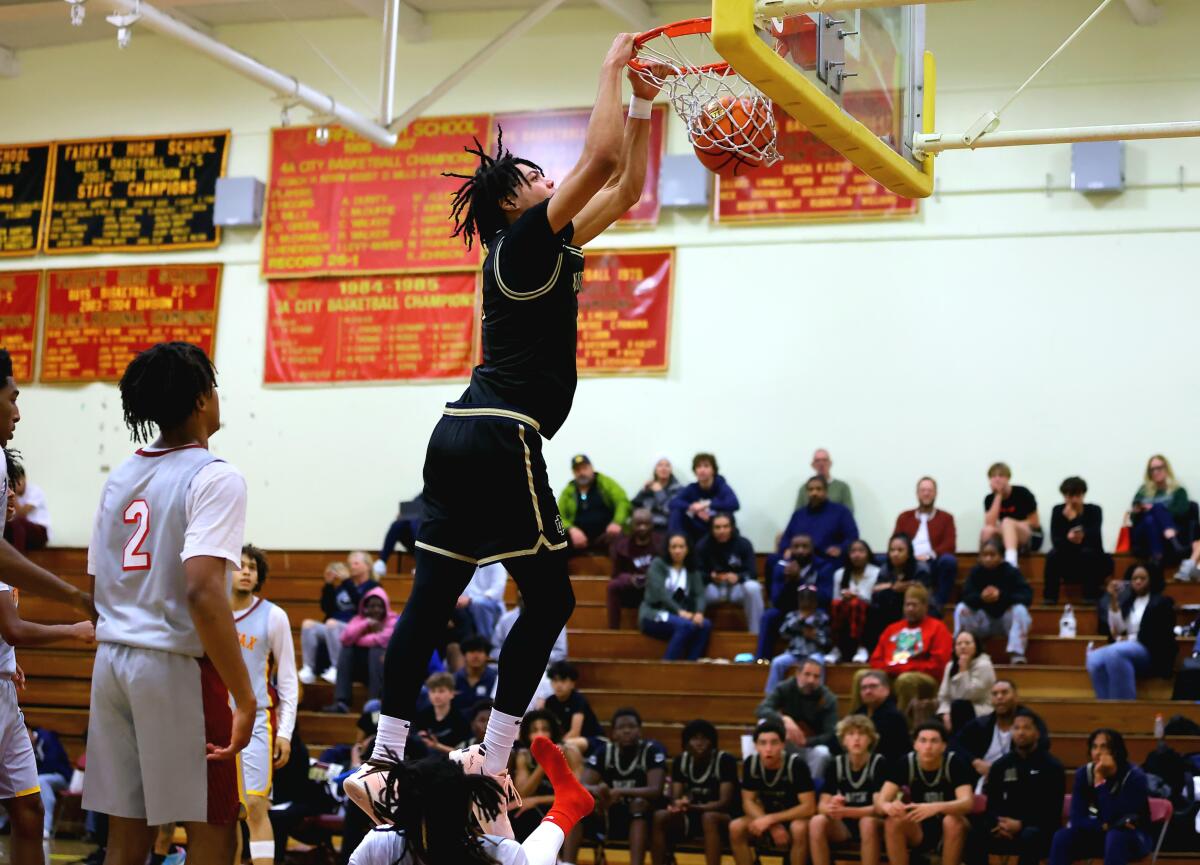 Tyran Stokes of Sherman Oaks Notre Dame gets a dunk against Fairfax.