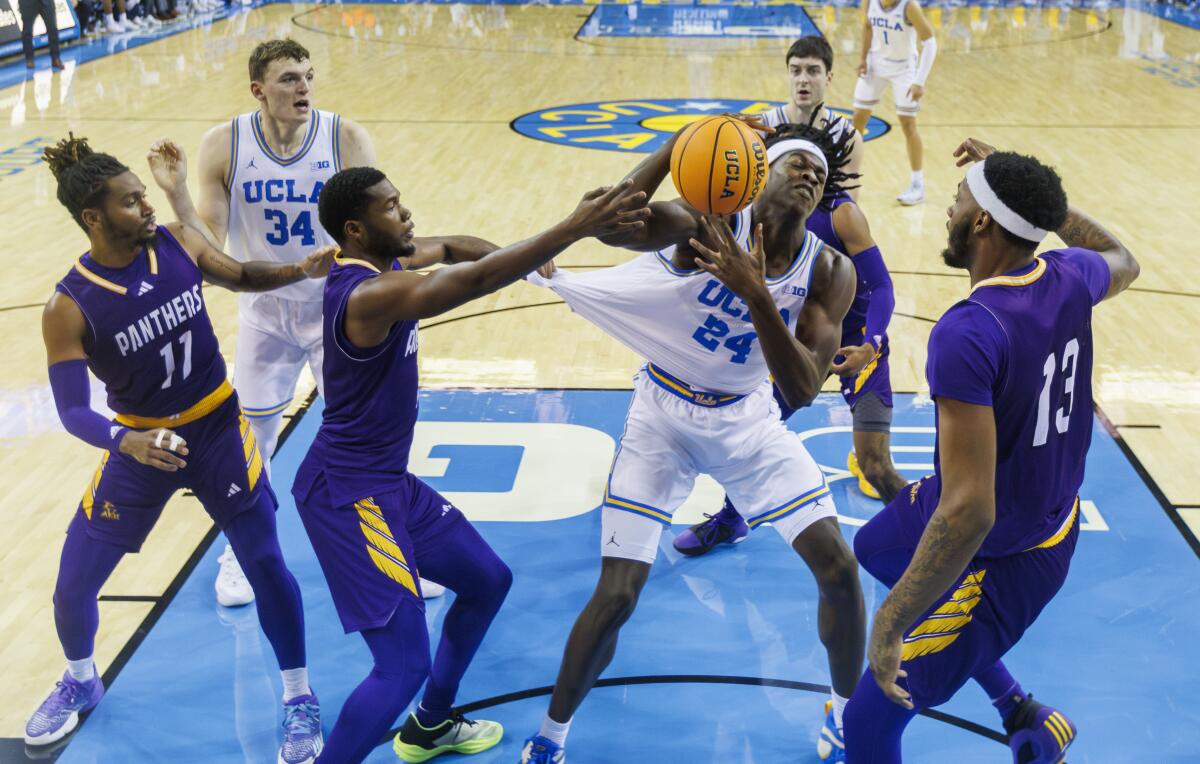 Bruins forward William Kyle III get this shirt pulled while grabbing an offensive rebound in the first half.