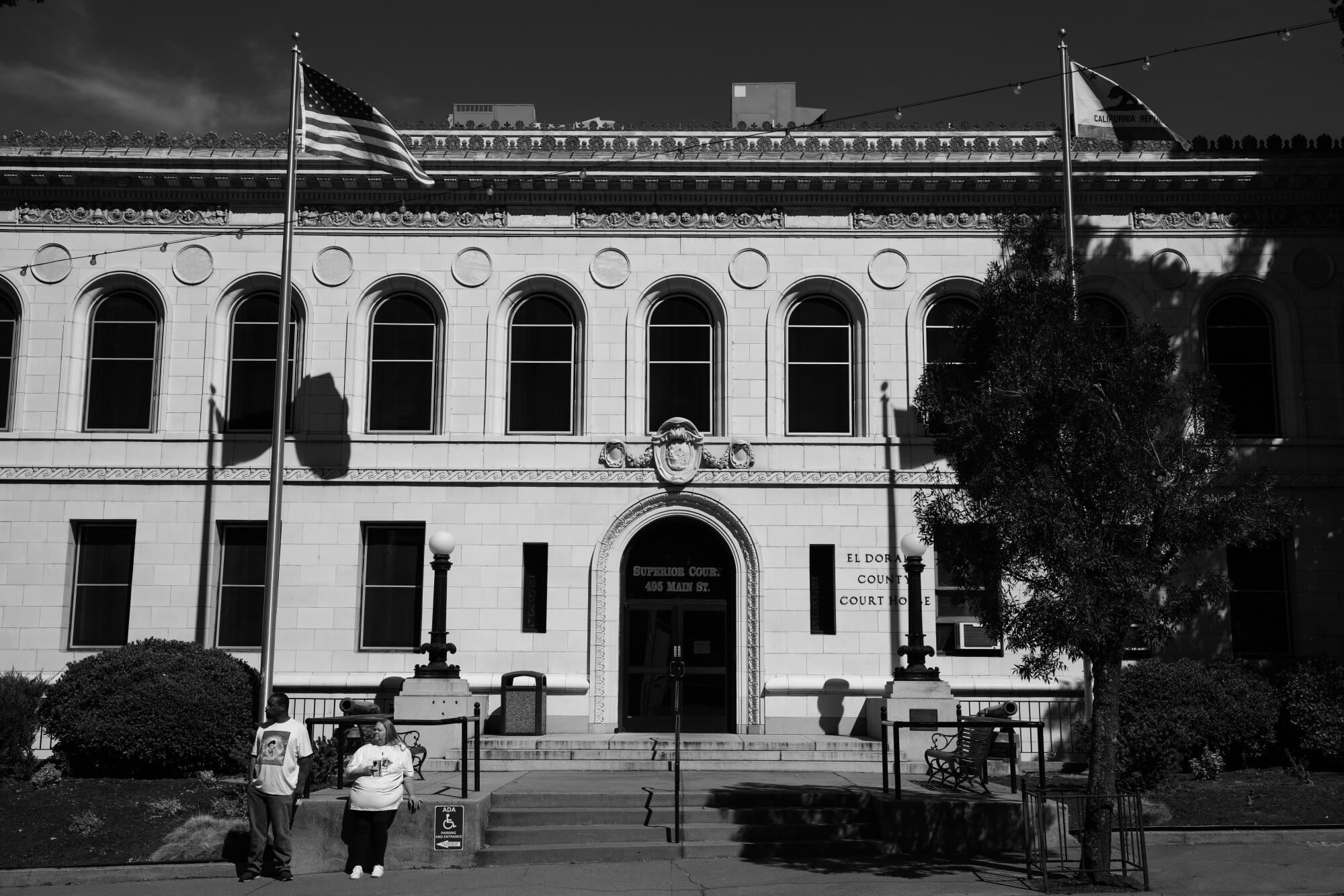 A flag waves in front of the stately El Dorado County courthouse in Placerville. 