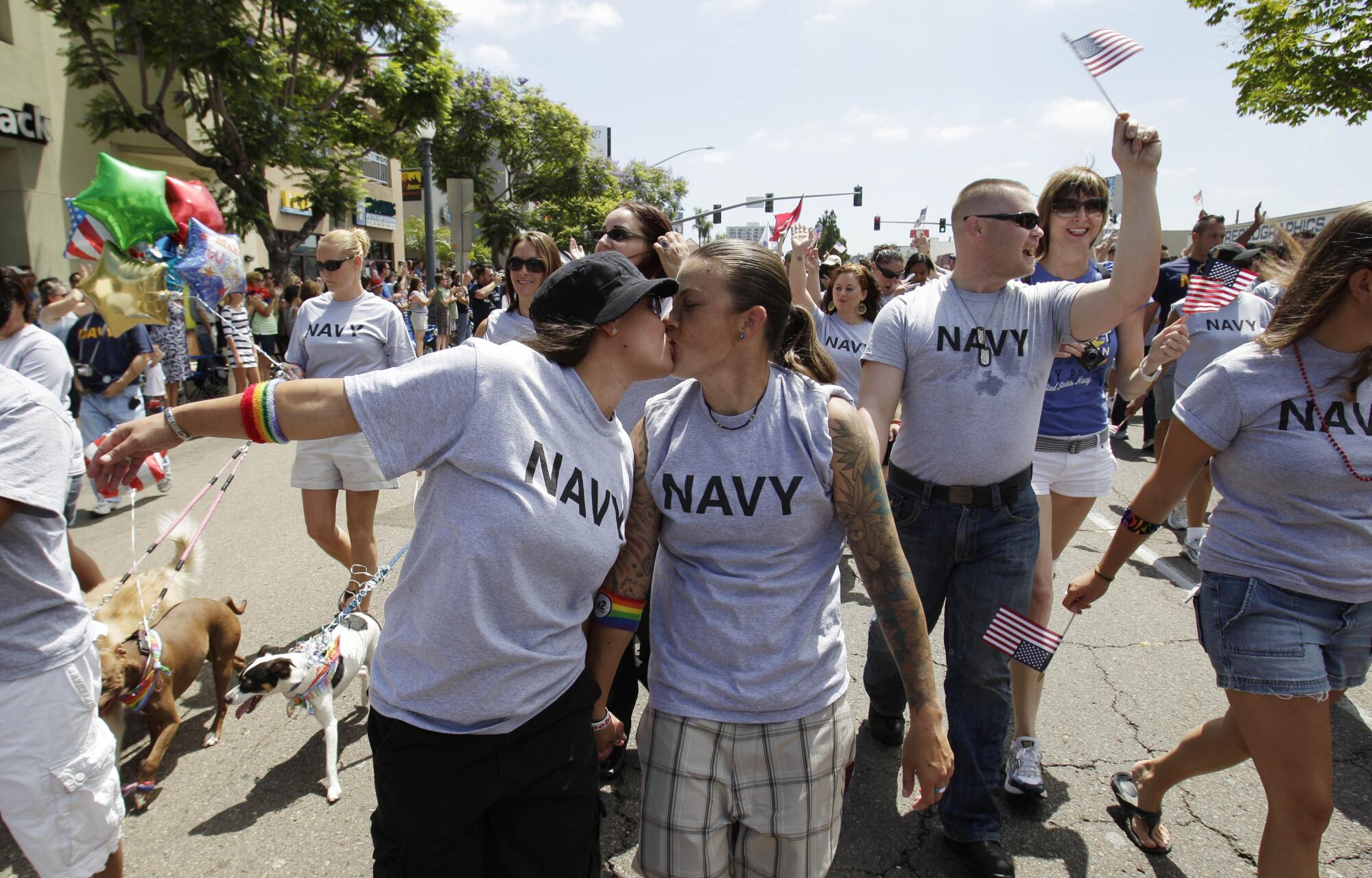 Sailors kiss during a parade