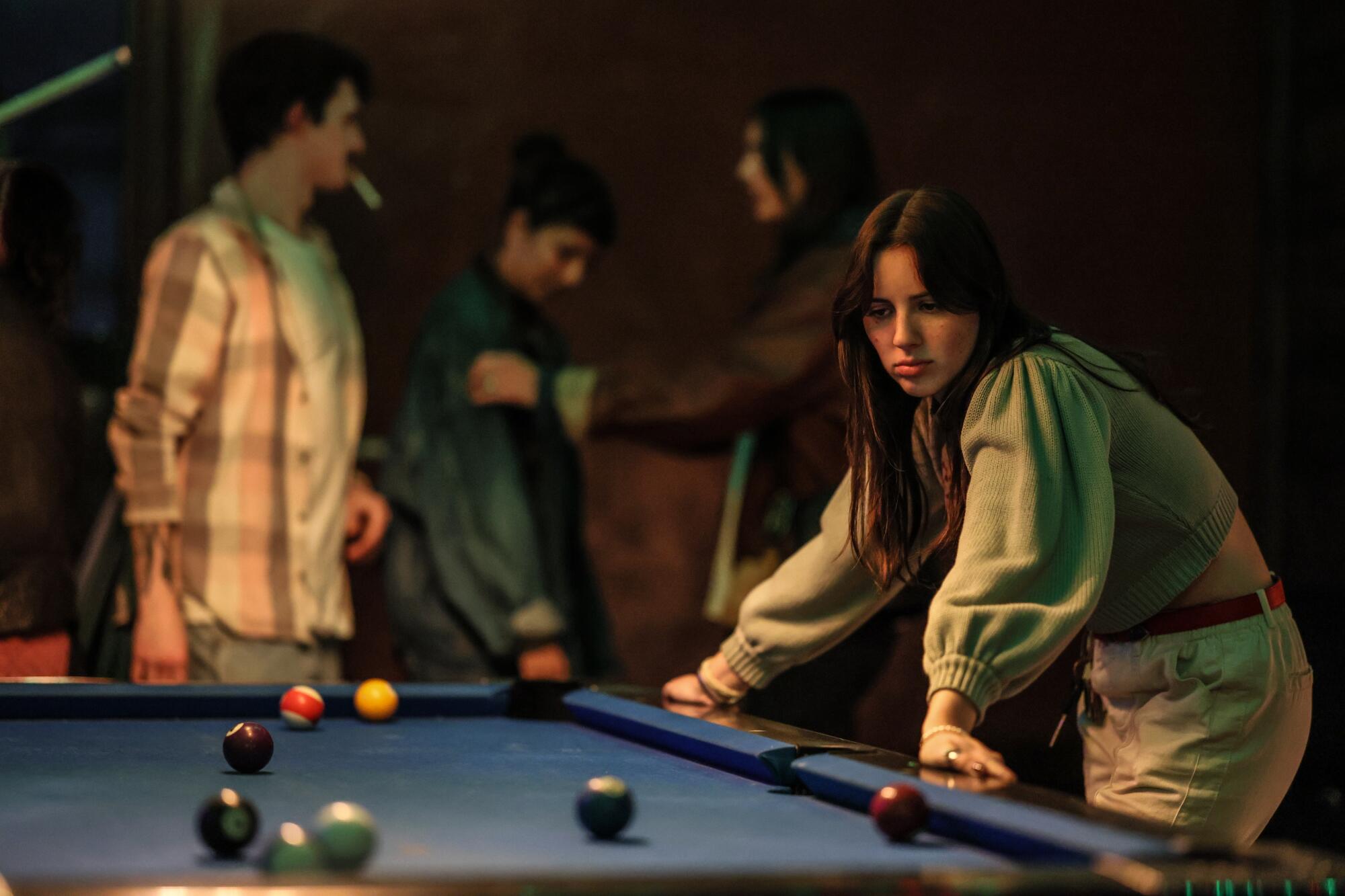 Diana Brennan sizes up the playing field while participating in the "Please Be Nice to Me" pool tournament at bar 4100. 