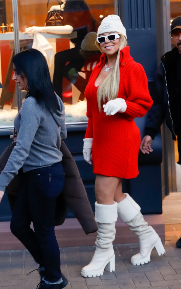 The vocal powerhouse turned heads in a bold red knit minidress featuring a plunging neckline