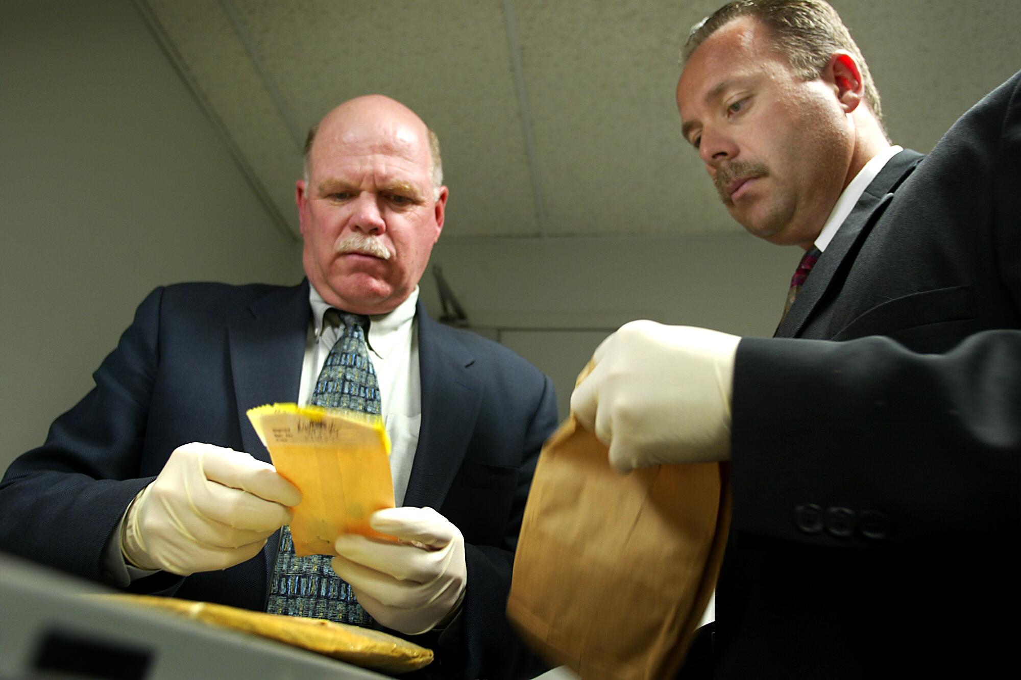 A 2003 photo of Los Angeles Police Department detectives Rick Jackson, left, and Tim Marcia.