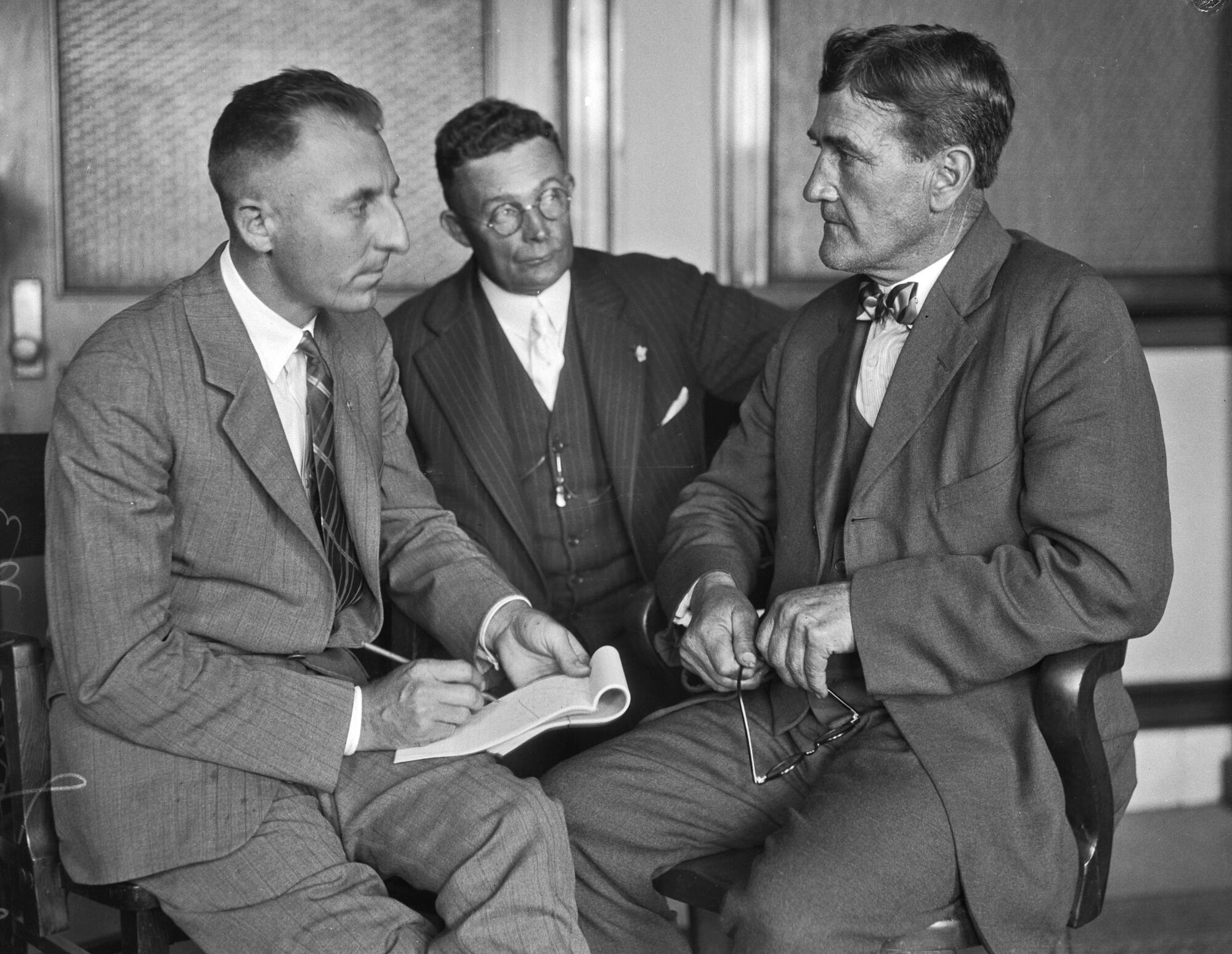 A 1925 photo of L.A. prosecutor Buron Fitts with two other men. 