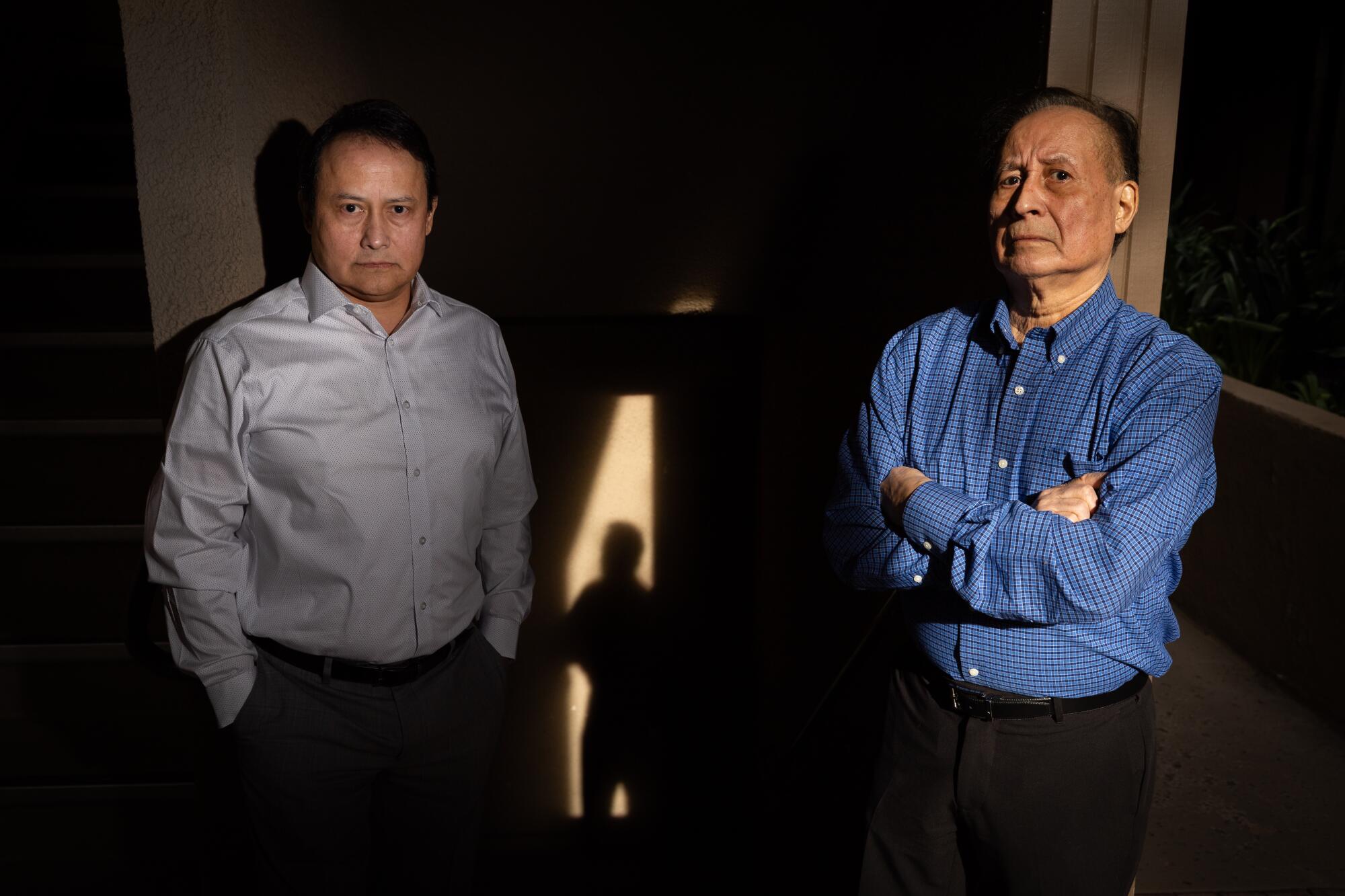 Thomas Perez Jr. and his father, Thomas Perez Sr., stand side by side. 