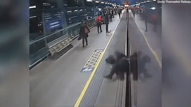 The commuter falls to the platform