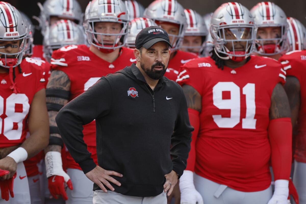 Ohio State coach Ryan Day leads his team to the field during a win over Nebraska in October.