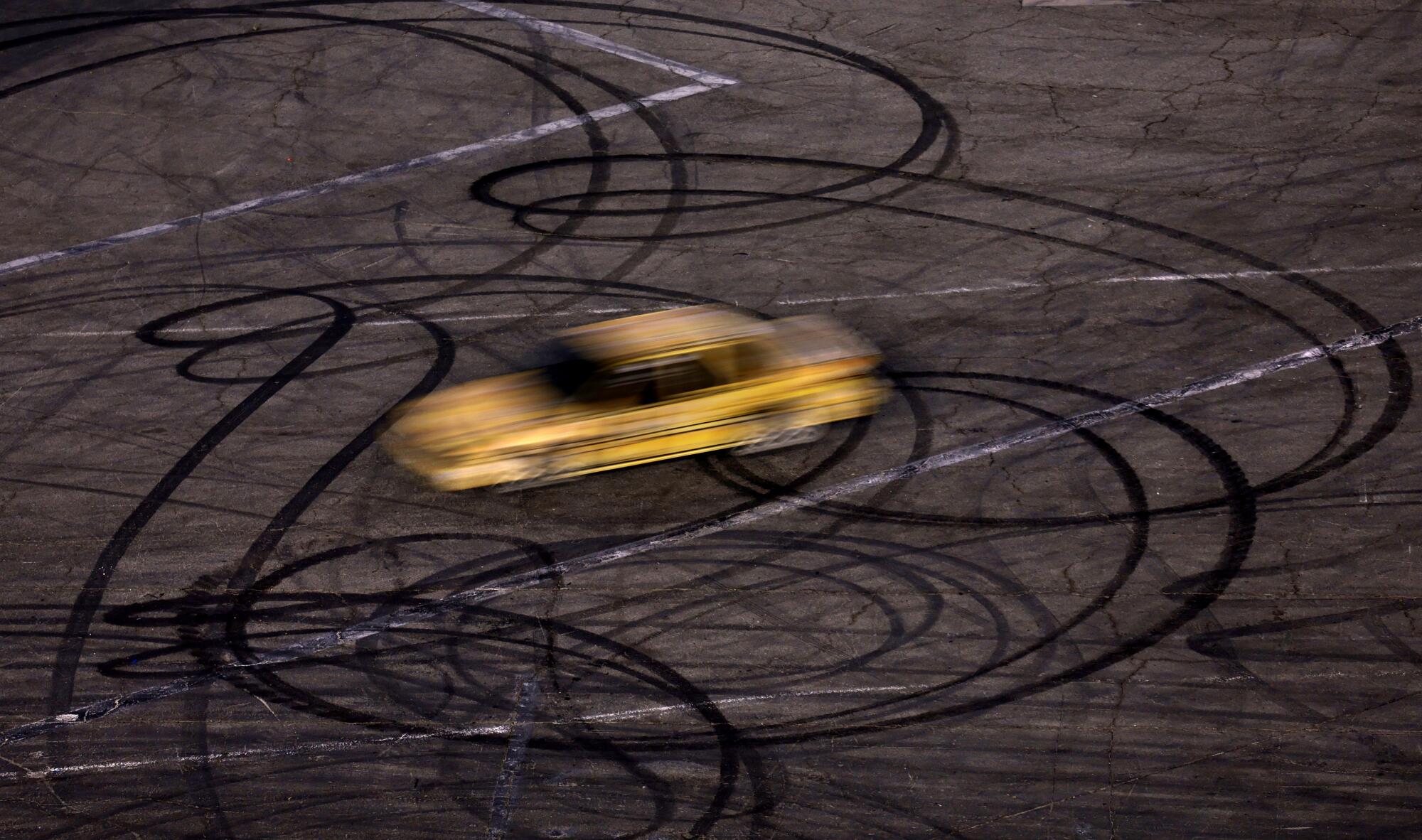 A competitor speeds through a figure-8 race on the final day of competition at Irwindale Speedway.