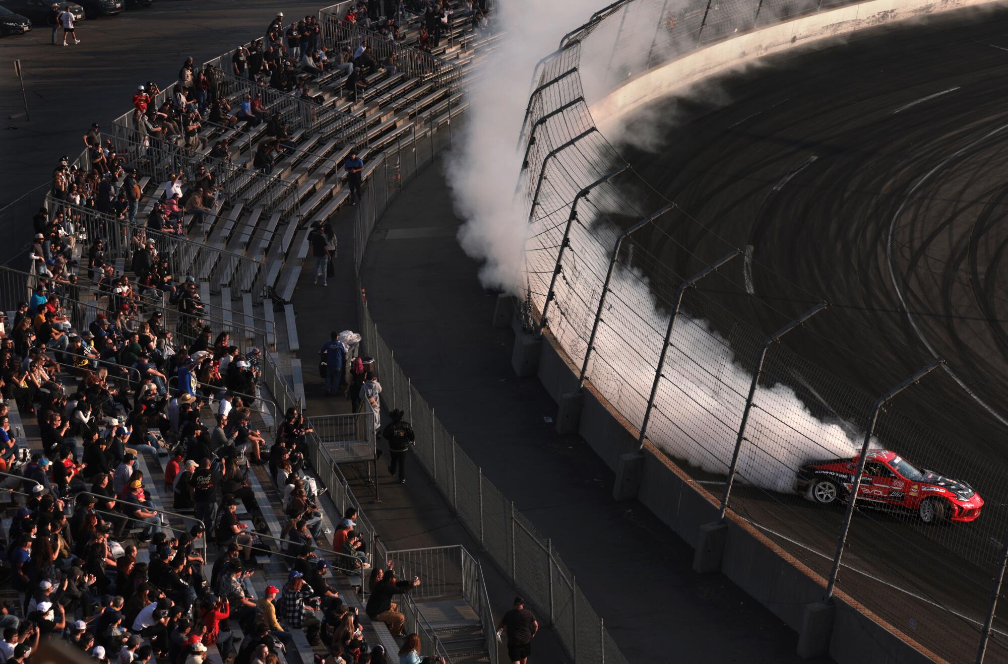 A car drifts around the track on the final day of racing at Irwindale Speedway.