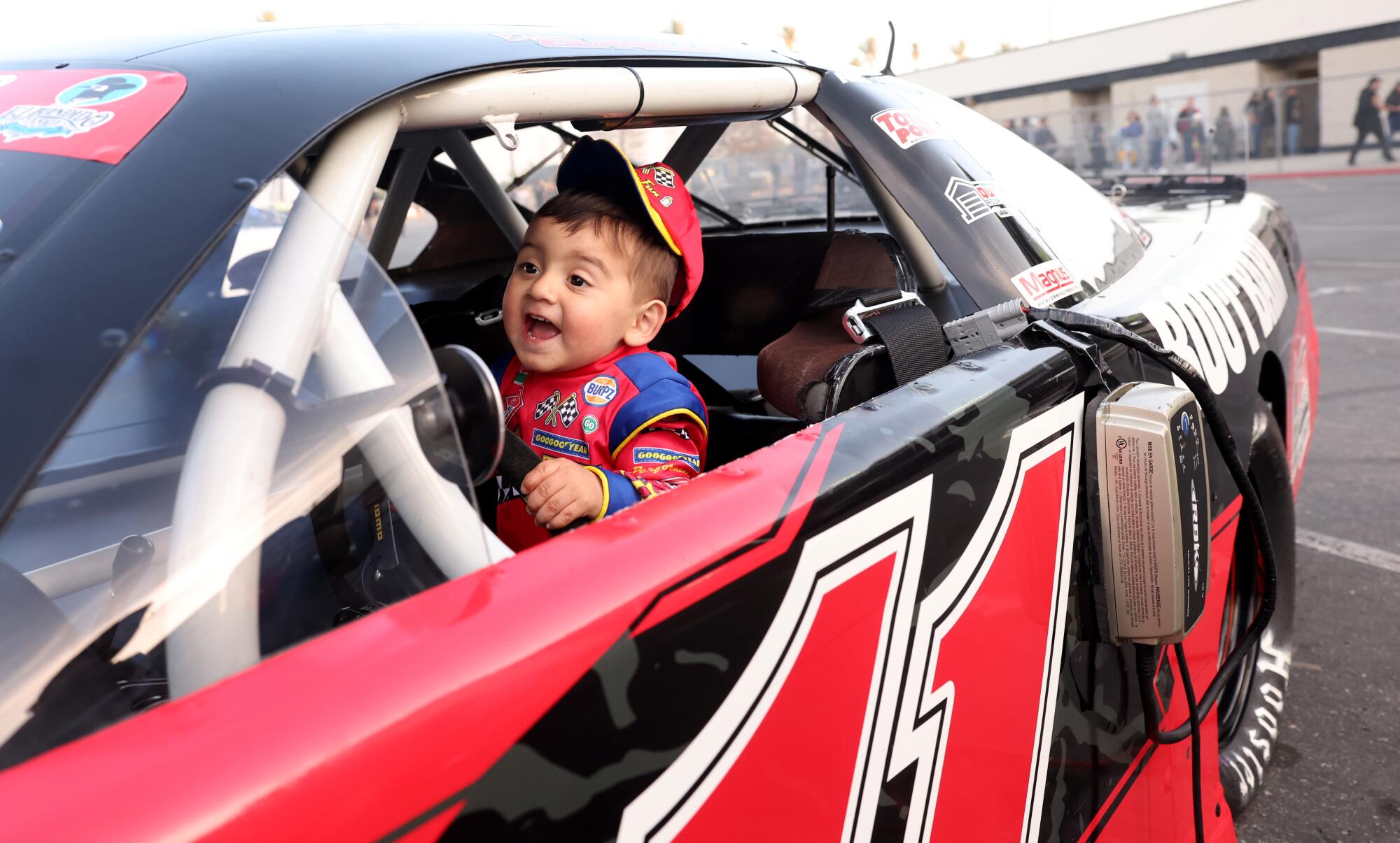 Maximiliano Vega, 1, sits in a race car during the last final day of racing at Irwindale Speedway.