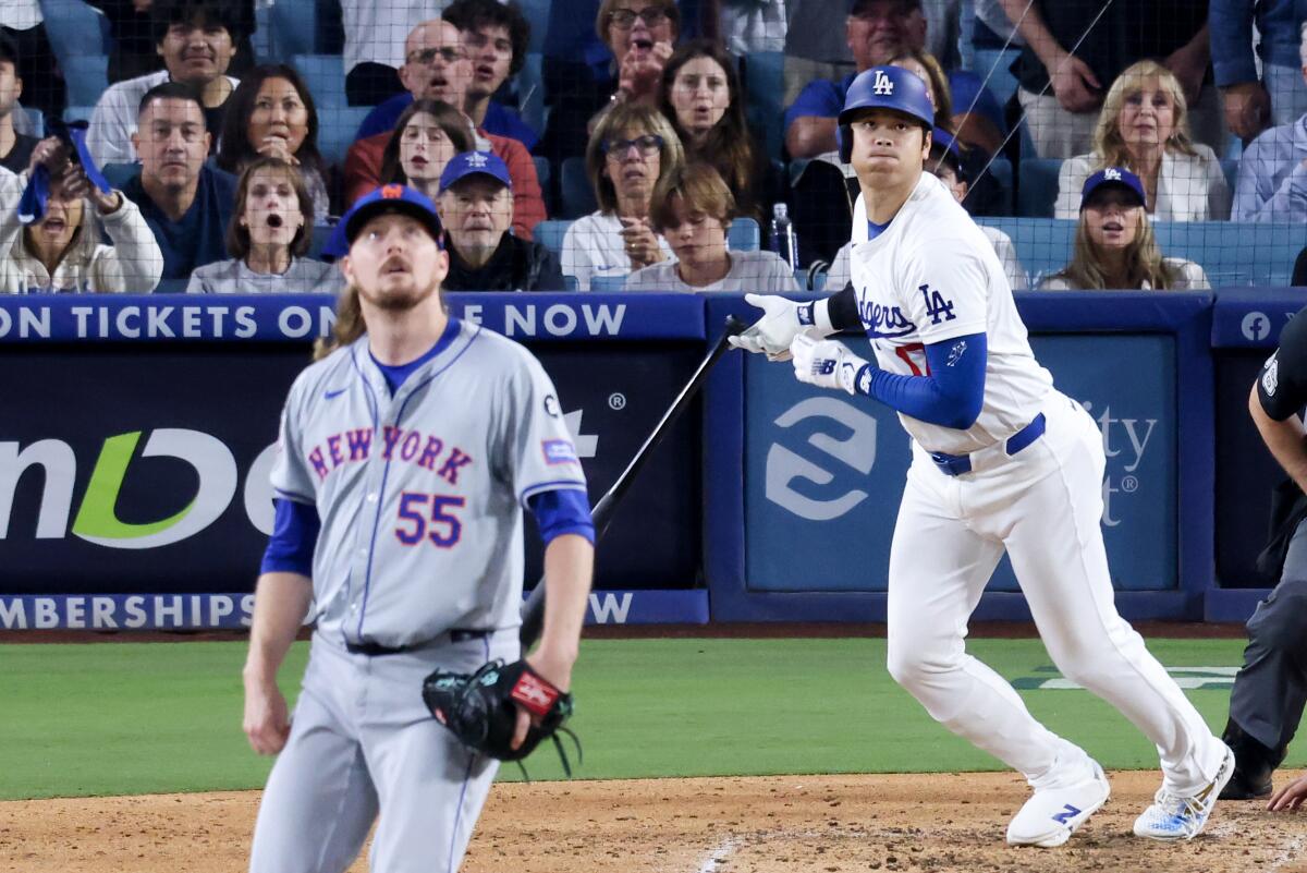 Dodgers star Shohei Ohtani hits a RBI single off Mets pitcher Ryne Stanek in Game 6 of the NLCS at Dodger Stadium on Oct. 20.