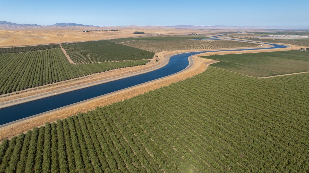 The California Aqueduct, part of the State Water Project, runs through farmland