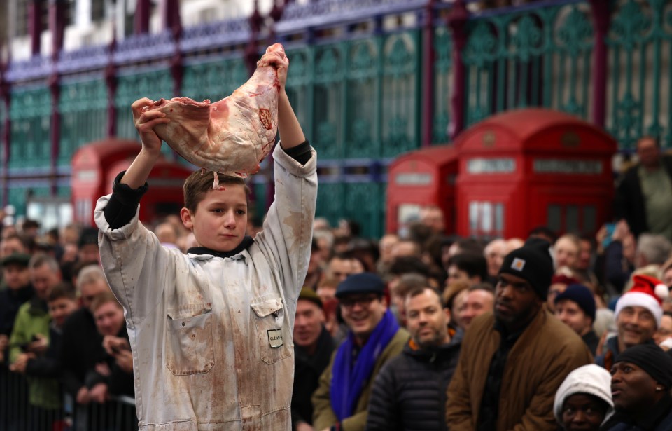 A young meat trader sells meat this Christmas Eve