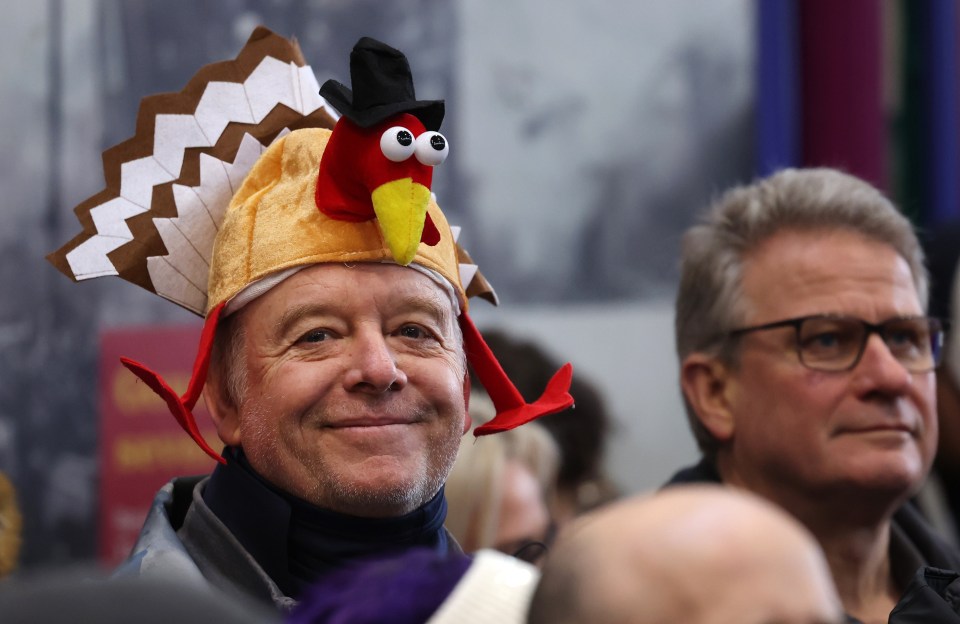 A man smiles during the Christmas Eve turkey and meat auction