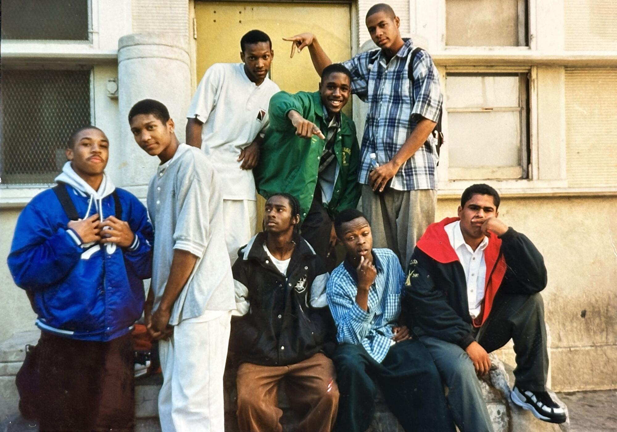 Albert Sanders Jr., top center, with friends and basketball teammates at Jefferson High School in the late 1990s.