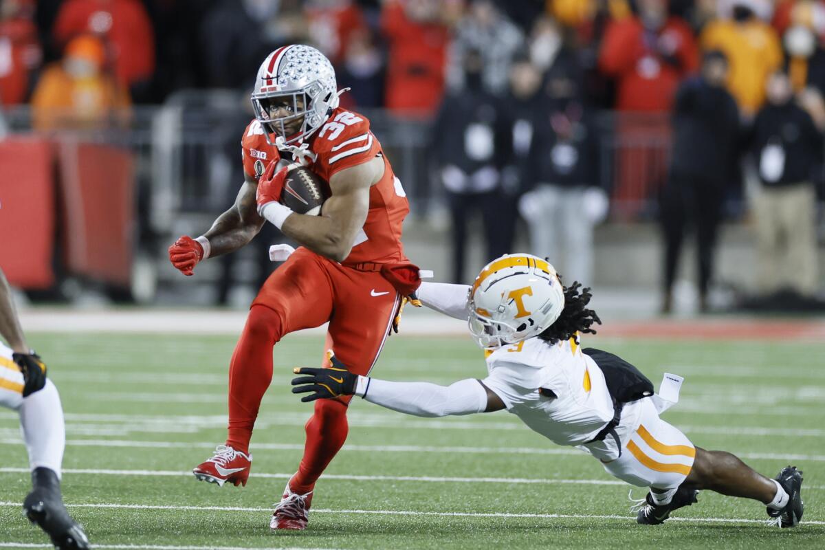 Ohio State quarterback Will Howard carries the ball against Tennessee during the College Football Playoff