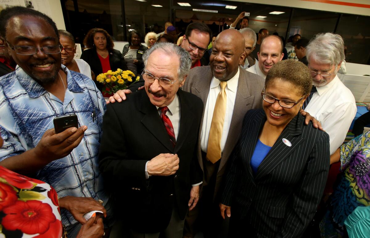 Aug. 2014 photo of then LAUSD board candidate George McKenna greeting supporters.