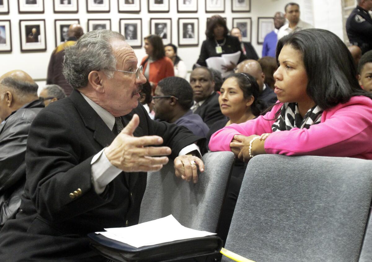 George McKenna speaking with an advocate for charter schools in 2013.