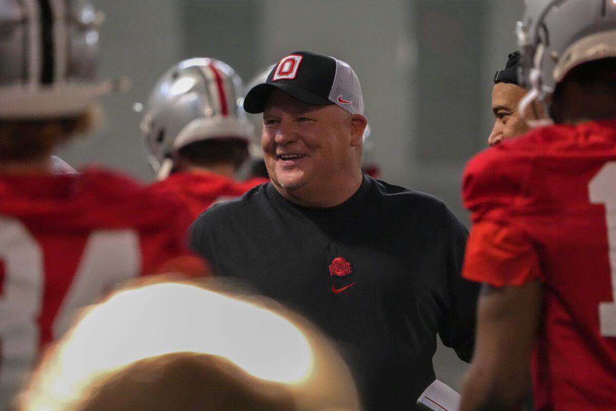 Ohio State offensive coordinator Chip Kelly smiles while coaching players at the Woody Hayes Athletic Center.