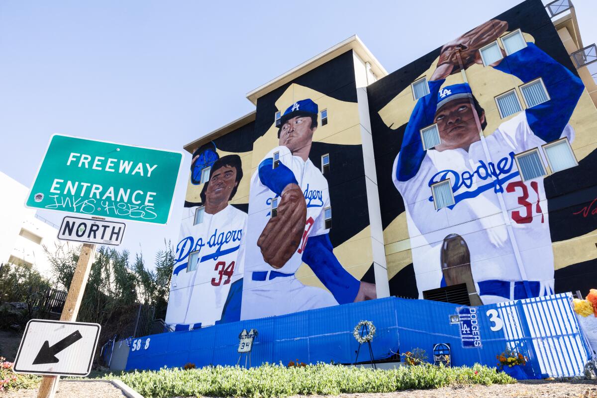 A six-story, three-panel mural of Fernando Valenzuela  is on a building near the 1st Street entrance to the 101 freeway