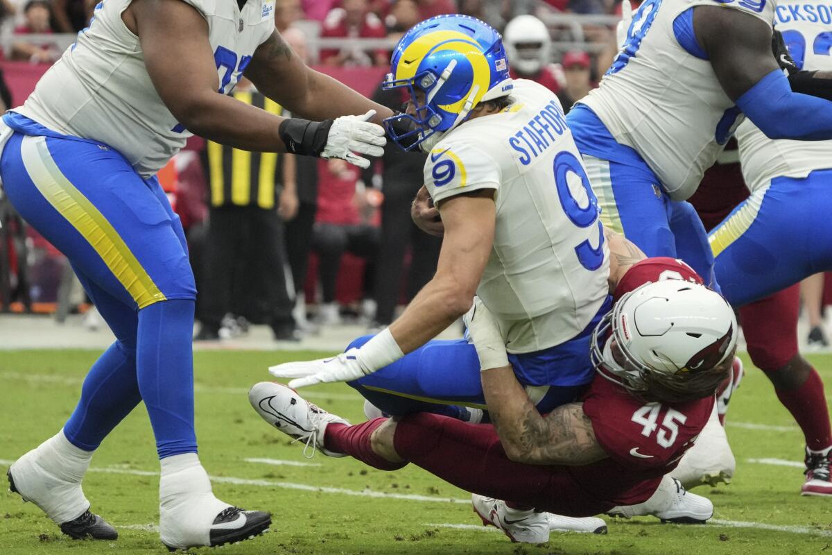 Cardinals linebacker Dennis Gardeck (45) sacks Rams quarterback Matthew Stafford (9) in September.