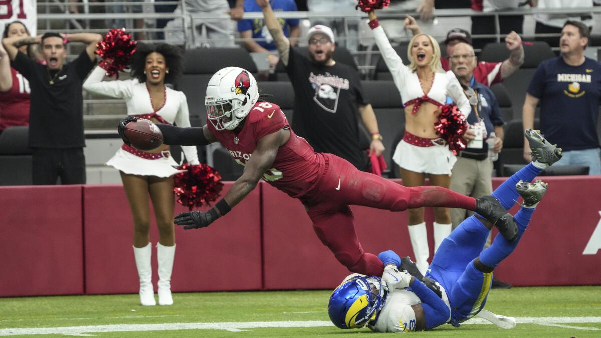 Cardinals receiver Marvin Harrison Jr. (18) stretches for a touchdown after making a catch against the Rams in September. 