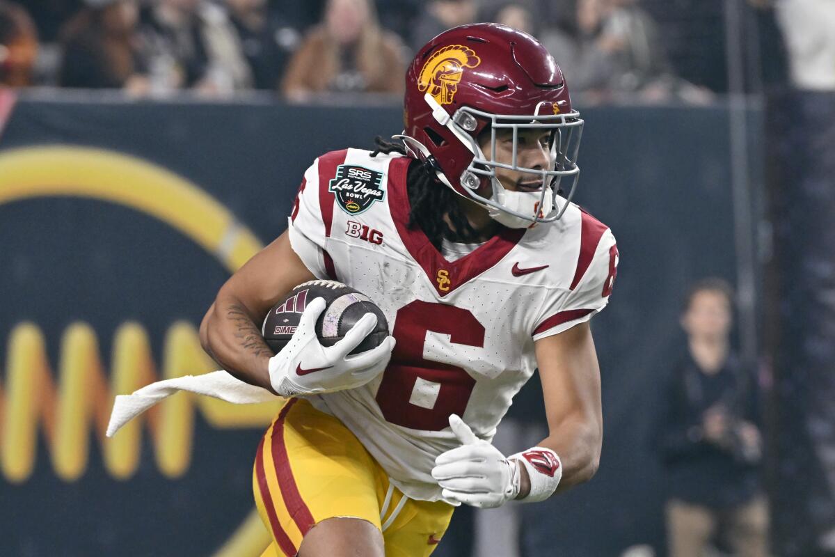 USC wide receiver Makai Lemon runs with the ball during the first half of the Trojans' Las Vegas Bowl win Friday night.