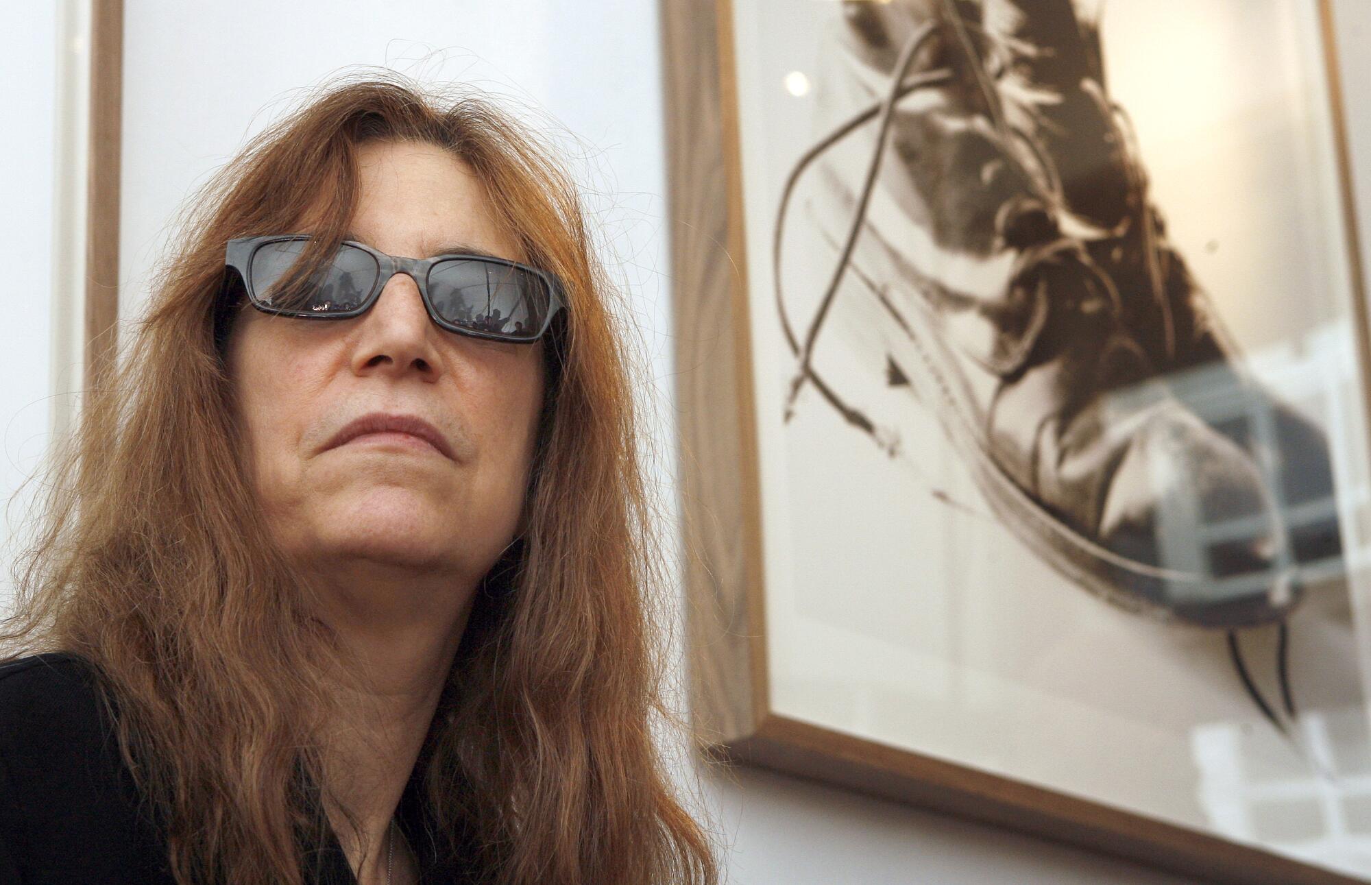 US singer Patti Smith is seen during the visit of the multimedia exhibition 'Objects of Life' in Berlin, Germany