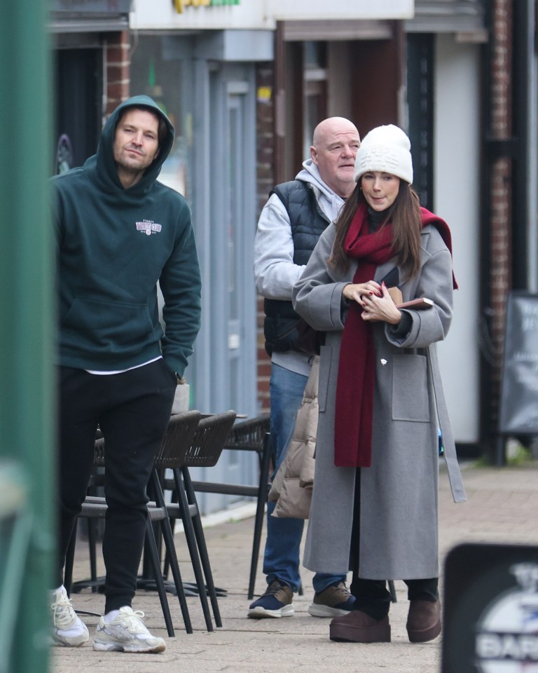 She padded around in chocolate brown Ugg boots as she was joined by her mum and step-dad