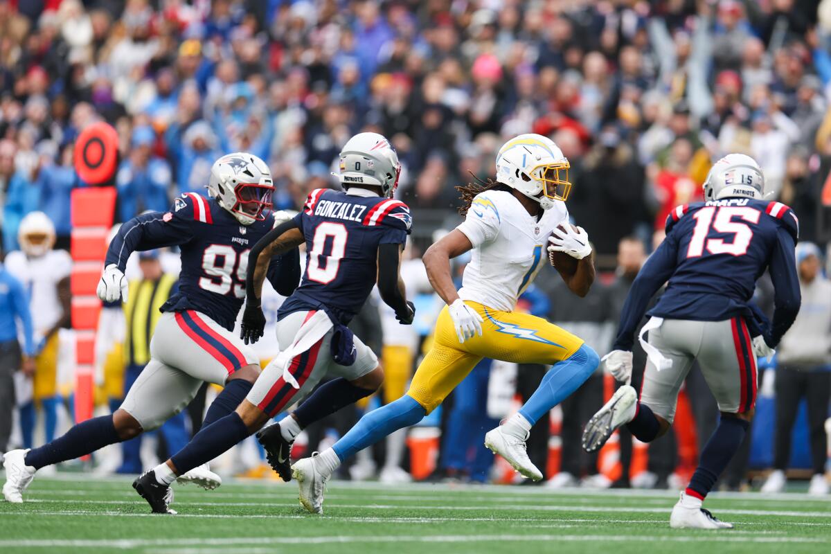 The Chargers' Quentin Johnston (1) finds running room after a catch against the Patriots. 