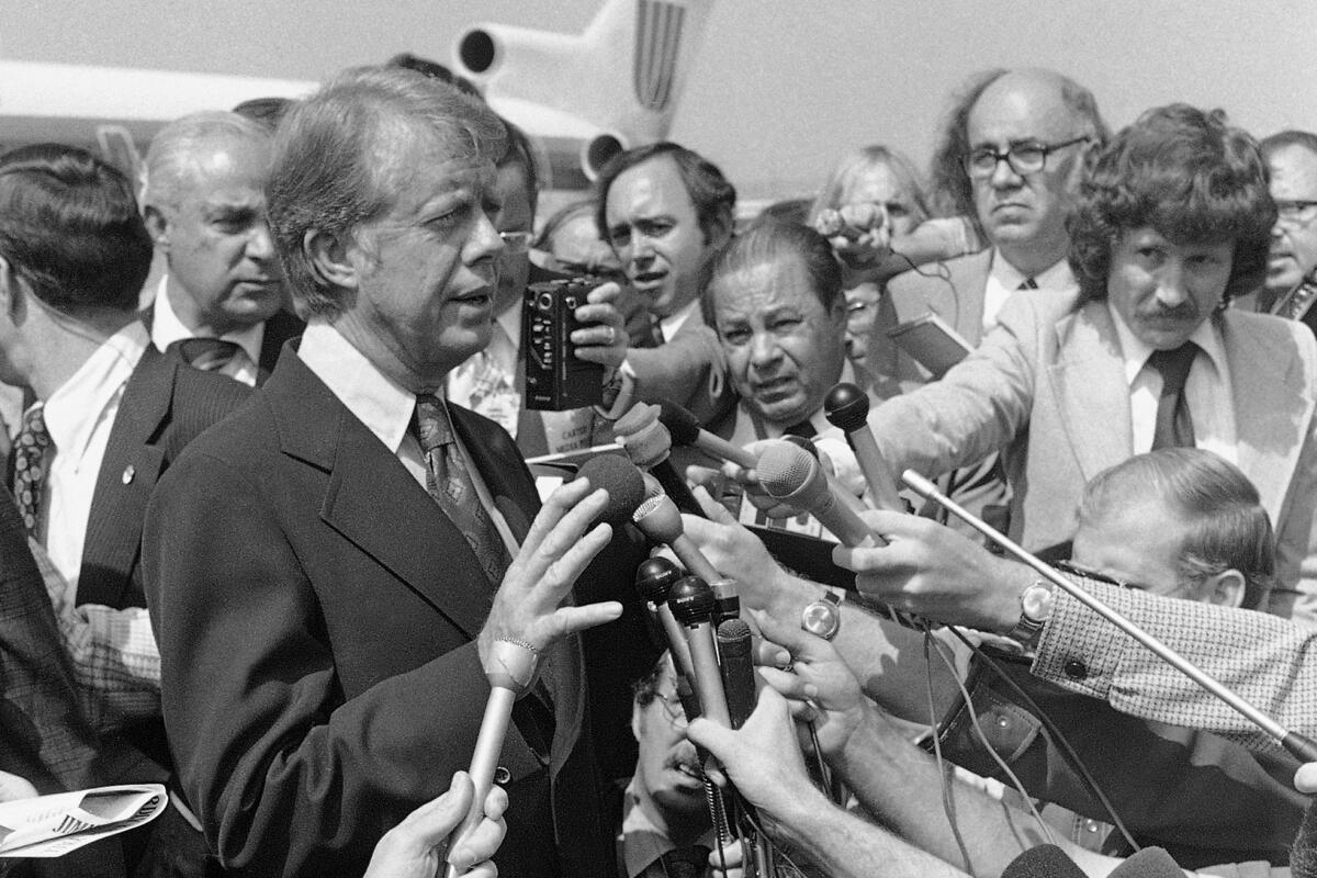 Democratic presidential nominee Jimmy Carter speaks to reporters.