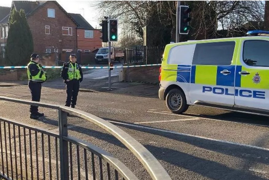 Officers guard a police cordon on Heanor Road in Ilkeston