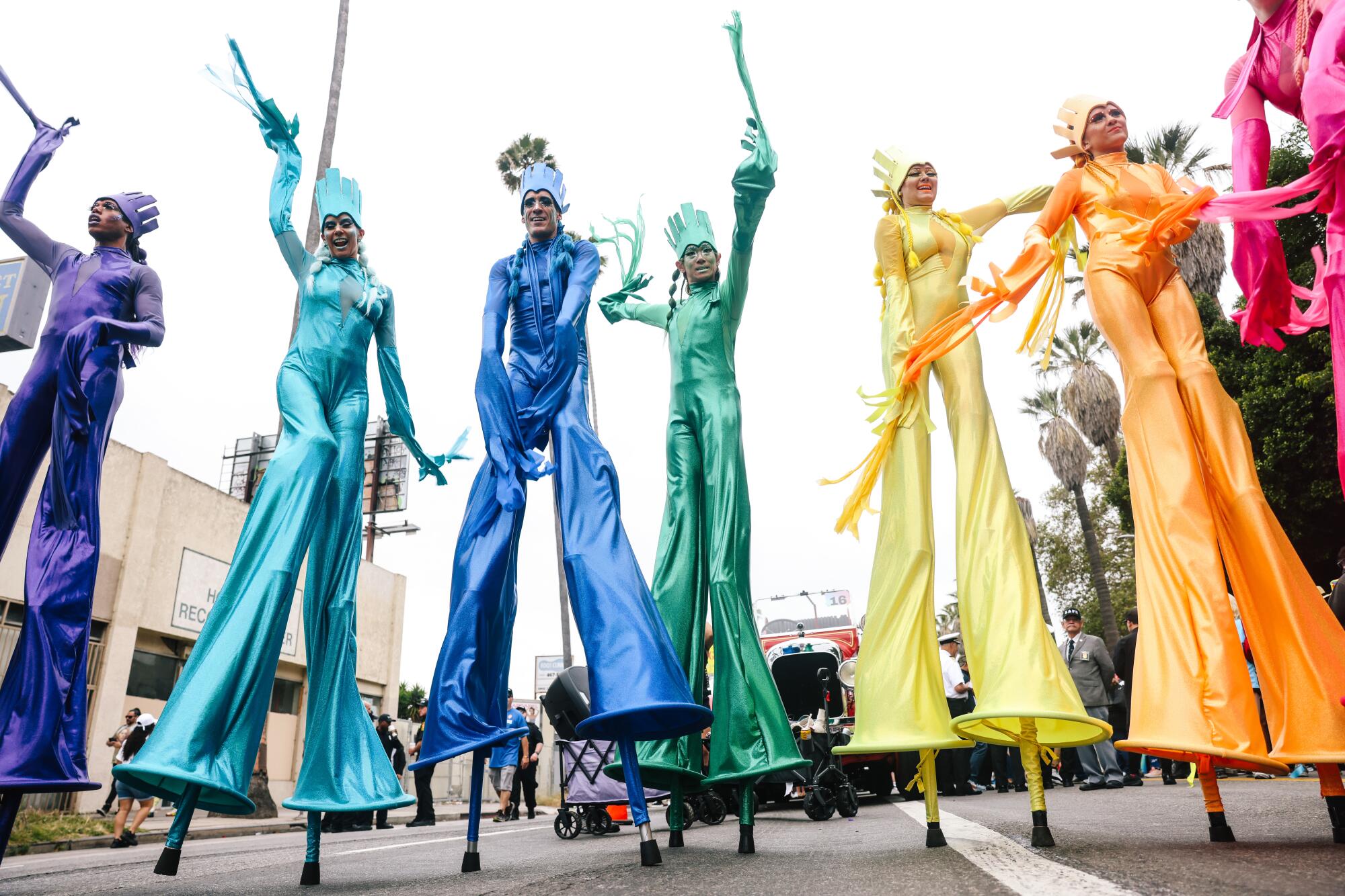 Costumed performers on stilts