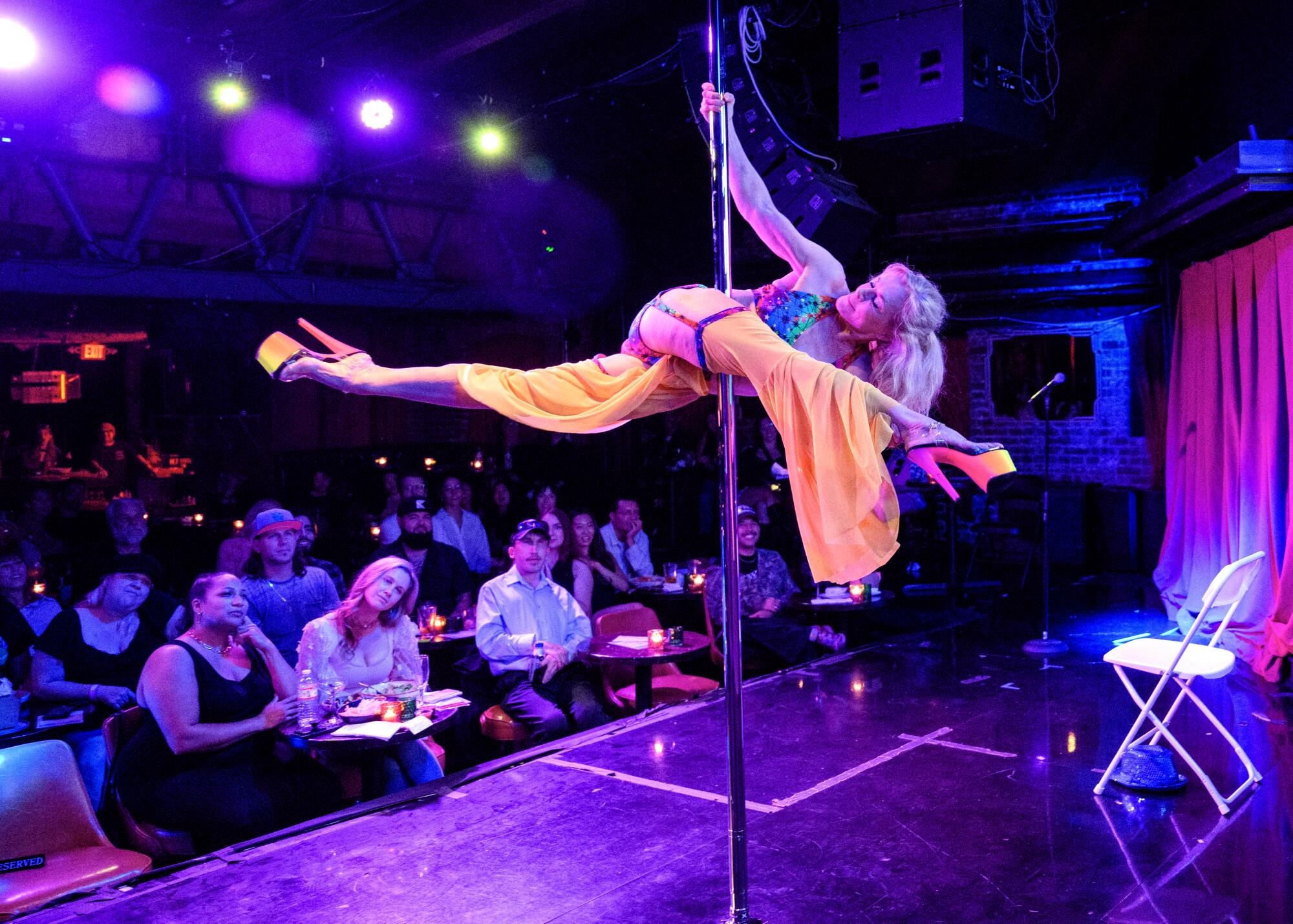 Mary Serritella, 71, performs in front of a live audience during the Comedy Pole Show