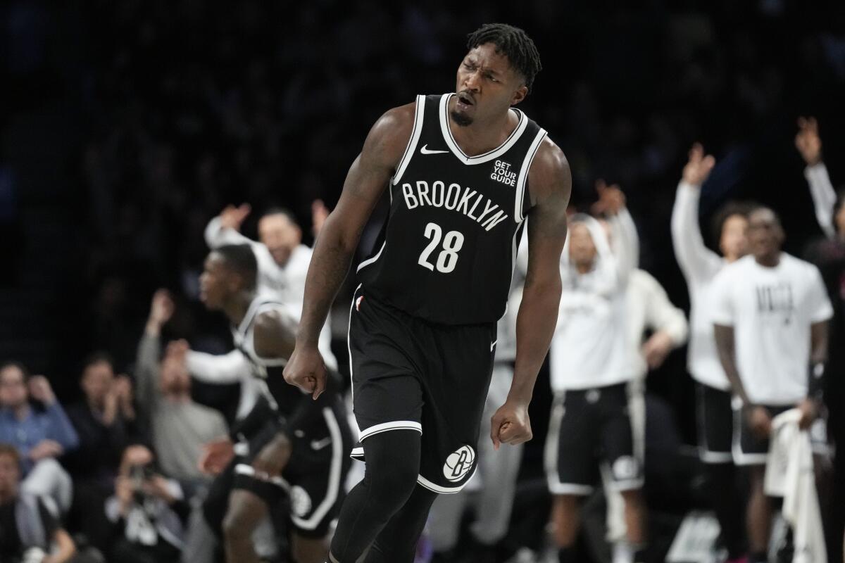 Dorian Finney-Smith reacts after scoring for the Brooklyn Nets during a game against the Memphis Grizzlies.