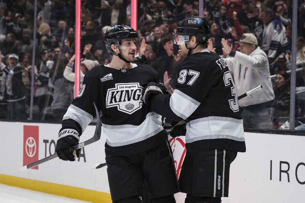 Kings left wing Warren Foegele celebrates with left wing Tanner Jeannot.