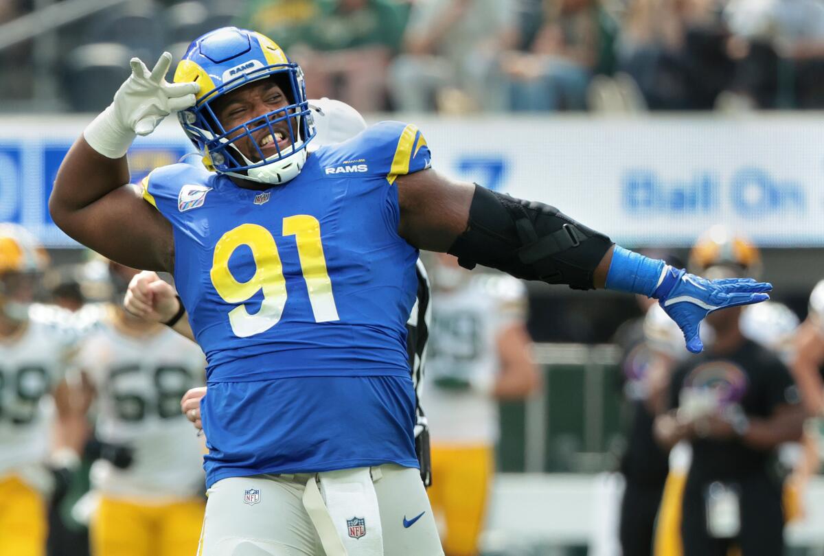 Rams defensive lineman Kobie Turner celebrates his sack.