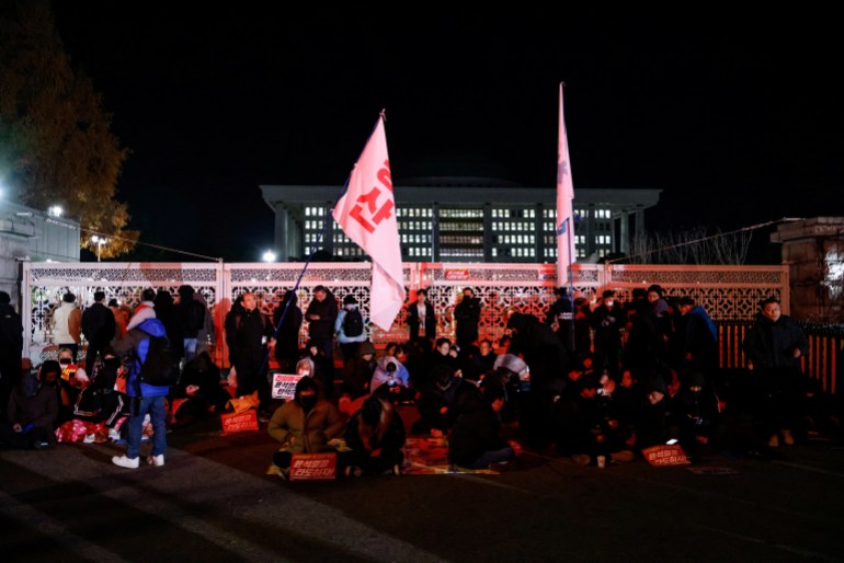 People gather outside the National Assembly in Seoul