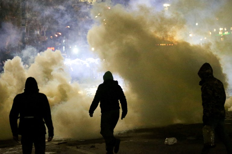 Demonstrators clash with police officers during a protest by supporters of Georgia's opposition parties against the government's decision to suspend talks on joining the European Union, in Tbilisi, Georgia December 4, 2024