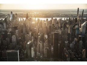 Buildings in the Manhattan skyline in New York, U.S., on Thursday June 17, 2021. New York state's pandemic mandates were lifted last week, after 70% of the adult population has now been given at least one dose of a coronavirus vaccine.