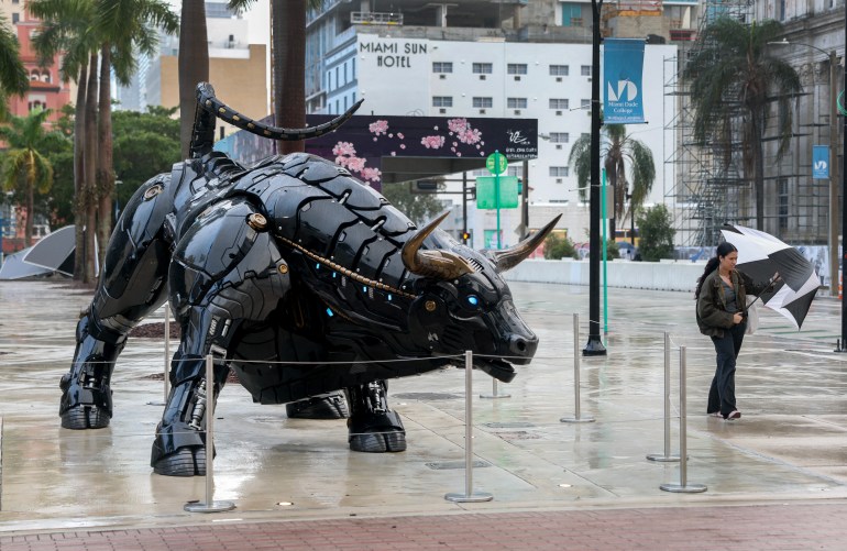 MIAMI, FLORIDA - DECEMBER 16: The robo-crypto bull statue is seen on the campus of the Miami Dade College Wolfson campus on December 16, 2024 in Miami, Florida. Bitcoin surged to a new all-time high, reaching $107,000 in anticipation of an interest rate cut by the Federal Reserve later this week. Joe Raedle/Getty Images/AFP (Photo by JOE RAEDLE / GETTY IMAGES NORTH AMERICA / Getty Images via AFP)