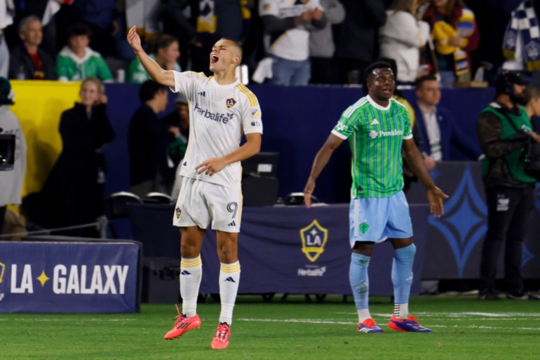 Los Angeles Galaxy forward Dejan Joveljic, left, celebrates after scoring during the second half of an MLS Western Conference final soccer match against the Seattle Sounders, Saturday, Nov. 30, 2024, in Carson, Calif. (AP Photo/Etienne Laurent)