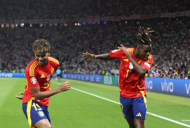 BERLIN, GERMANY - JULY 14: Nico Williams of Spain celebrates scoring his team's first goal with teammate Lamine Yamal during the UEFA EURO 2024 final match between Spain and England at Olympiastadion on July 14, 2024 in Berlin, Germany. (Photo by Richard Pelham/Getty Images)