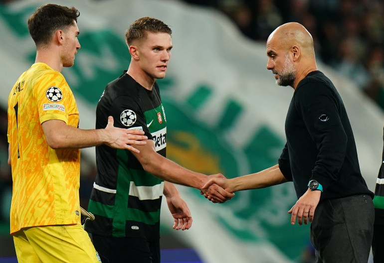 LISBON, PORTUGAL - NOVEMBER 5: Head Coach Josep Guardiola of Manchester City congratulates goal scorer Viktor Gyokeres of Sporting CP at the end of the UEFA Champions League 2024/25 League Phase MD4 match between Sporting CP and Manchester City at Estadio Jose Alvalade on November 5, 2024 in Lisbon, Portugal. (Photo by Gualter Fatia/Getty Images)