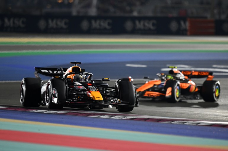 Max Verstappen and Lando Norris on track.